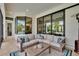 Inviting covered patio features comfortable seating and a view of the pool at 16406 Chapman Crossing Dr, Lithia, FL 33547