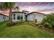 Charming single-story home with well-manicured landscaping, a two-car garage, and a welcoming front entrance at 19877 Sea Glass Cir, Land O Lakes, FL 34638