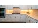 Close-up of the gourmet kitchen with stainless steel appliances and quartz countertops at 19877 Sea Glass Cir, Land O Lakes, FL 34638