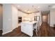 Modern kitchen with white cabinets, stainless steel appliances, and a center island with seating at 19877 Sea Glass Cir, Land O Lakes, FL 34638