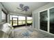 Relaxing screened lanai with views of the lake and outdoor area with grill at 19877 Sea Glass Cir, Land O Lakes, FL 34638