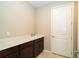 Functional laundry room features ample counter space, undermount sink, and cabinet storage at 19877 Sea Glass Cir, Land O Lakes, FL 34638