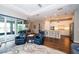 Open-concept living room with neutral walls and recessed lighting, seamlessly connected to the dining area and kitchen at 19877 Sea Glass Cir, Land O Lakes, FL 34638