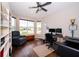 Bright home office with built-in shelving, a large window, and hardwood floors at 19877 Sea Glass Cir, Land O Lakes, FL 34638