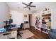 Cozy office space includes a ceiling fan, lots of light, a bookshelf, and a desk with all your office needs at 19877 Sea Glass Cir, Land O Lakes, FL 34638