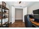 Comfortable home office with wood floors, a modern workstation, and an alcove for extra storage or other needs at 19877 Sea Glass Cir, Land O Lakes, FL 34638