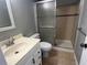 Bathroom featuring neutral decor with vanity and tiled shower at 2068 San Marino N Way, Clearwater, FL 33763