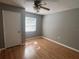 Bright and airy bedroom with wood floors, a window, and a closet at 2068 San Marino N Way, Clearwater, FL 33763