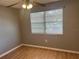 Cozy bedroom with wood flooring and a window at 2068 San Marino N Way, Clearwater, FL 33763