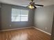 Well lit room featuring a ceiling fan and light wood flooring at 2068 San Marino N Way, Clearwater, FL 33763