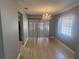 Modern dining room features tile flooring, large windows, and a chandelier at 2068 San Marino N Way, Clearwater, FL 33763