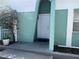 The exterior view shows a modern house with a well-maintained front door and landscaping at 2068 San Marino N Way, Clearwater, FL 33763