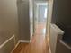Hallway with wood floors leading to bedrooms and closets at 2068 San Marino N Way, Clearwater, FL 33763