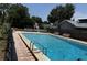 Community pool with benches and a fence at 2068 San Marino N Way, Clearwater, FL 33763
