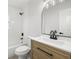 Modern bathroom with wood vanity, white countertop, black fixtures, and tiled shower/bath at 2157 20Th Sw Ave, Largo, FL 33774