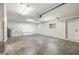 Spacious garage with white walls, a small window and a white exterior door at 2157 20Th Sw Ave, Largo, FL 33774