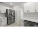 Contemporary kitchen featuring stainless steel appliances, white cabinets, and stylish countertops, combining functionality with design at 2157 20Th Sw Ave, Largo, FL 33774
