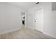 Open living room leads to kitchen featuring light-colored walls and floors and neutral finishes at 2157 20Th Sw Ave, Largo, FL 33774