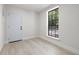 Bright room with tiled floor, and large window at 2157 20Th Sw Ave, Largo, FL 33774