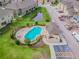 Aerial shot of a community pool next to a construction area with nearby townhomes at 2234 Lennox Dale Ln, Brandon, FL 33510