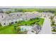 A picturesque aerial view displays houses, a pool, and a pond at 2234 Lennox Dale Ln, Brandon, FL 33510