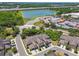 An aerial view displays townhomes near a large lake and highway at 2234 Lennox Dale Ln, Brandon, FL 33510