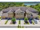 Aerial view of townhomes with garages and well manicured landscaping at 2234 Lennox Dale Ln, Brandon, FL 33510