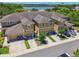 Aerial view of townhomes with garages and well manicured landscaping at 2234 Lennox Dale Ln, Brandon, FL 33510