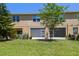 Well-maintained backyard with lush lawn and a screened in porch at 2234 Lennox Dale Ln, Brandon, FL 33510