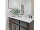 Bathroom featuring a vanity with a white countertop, gray cabinets, and framed wall decor at 2234 Lennox Dale Ln, Brandon, FL 33510
