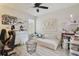 Cozy bedroom with ceiling fan and window, offering natural light at 2234 Lennox Dale Ln, Brandon, FL 33510