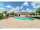 A sparkling kidney-shaped community pool with ample patio seating and a cabana at 2234 Lennox Dale Ln, Brandon, FL 33510