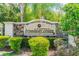 The Townhomes at Broadway Centre community sign with lush landscaping at 2234 Lennox Dale Ln, Brandon, FL 33510