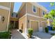 Two-story townhome featuring an attached garage and inviting front entrance with landscaping at 2234 Lennox Dale Ln, Brandon, FL 33510