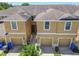 Inviting townhouse features a well-maintained exterior and a convenient one-car garage at 2234 Lennox Dale Ln, Brandon, FL 33510
