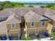 Charming townhouse showcases an attractive facade, complete with a one-car garage and well-manicured landscaping at 2234 Lennox Dale Ln, Brandon, FL 33510