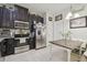Bright eat-in kitchen with stainless steel appliances, tile flooring, and ample cabinet space at 2234 Lennox Dale Ln, Brandon, FL 33510