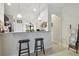 Open-concept kitchen with granite counters, breakfast bar and dark cabinetry at 2234 Lennox Dale Ln, Brandon, FL 33510
