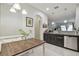 Eat-in kitchen boasts a wooden table, banquette seating, and views into the living area at 2234 Lennox Dale Ln, Brandon, FL 33510