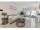 Bright living room with stylish decor, tile floors, and sliding doors to outdoor patio at 2234 Lennox Dale Ln, Brandon, FL 33510