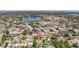 An aerial view of a neighborhood showcasing its proximity to a lake, park, and downtown at 2401 66Th S Ave, St Petersburg, FL 33712