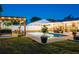 Spacious backyard featuring a pool, pergola, landscaping, and ample seating, creating an ideal outdoor living space at 2401 66Th S Ave, St Petersburg, FL 33712