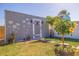 Backyard shed with decorative mural and landscaping, adding charm and functionality to the outdoor space at 2401 66Th S Ave, St Petersburg, FL 33712