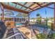 Inviting backyard seating with pergola offering shade for enjoying a refreshing dip in the pool and outdoor living at 2401 66Th S Ave, St Petersburg, FL 33712