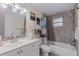 Bathroom features a shower over tub combination and large mirror at 2401 66Th S Ave, St Petersburg, FL 33712