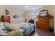 Comfortable bedroom with wood floors, dresser and closet space at 2401 66Th S Ave, St Petersburg, FL 33712