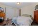 Bedroom featuring dark wood laminate floors, ceiling fan, and closet at 2401 66Th S Ave, St Petersburg, FL 33712