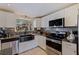 Gorgeous kitchen featuring stainless steel appliances, granite countertops, and modern backsplash at 2401 66Th S Ave, St Petersburg, FL 33712