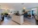 Open concept living area with kitchen island and views to the front yard at 2401 66Th S Ave, St Petersburg, FL 33712