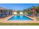 Backyard pool featuring beautiful brick deck, privacy fence, outdoor pergola, and lush landscaping at 2401 66Th S Ave, St Petersburg, FL 33712